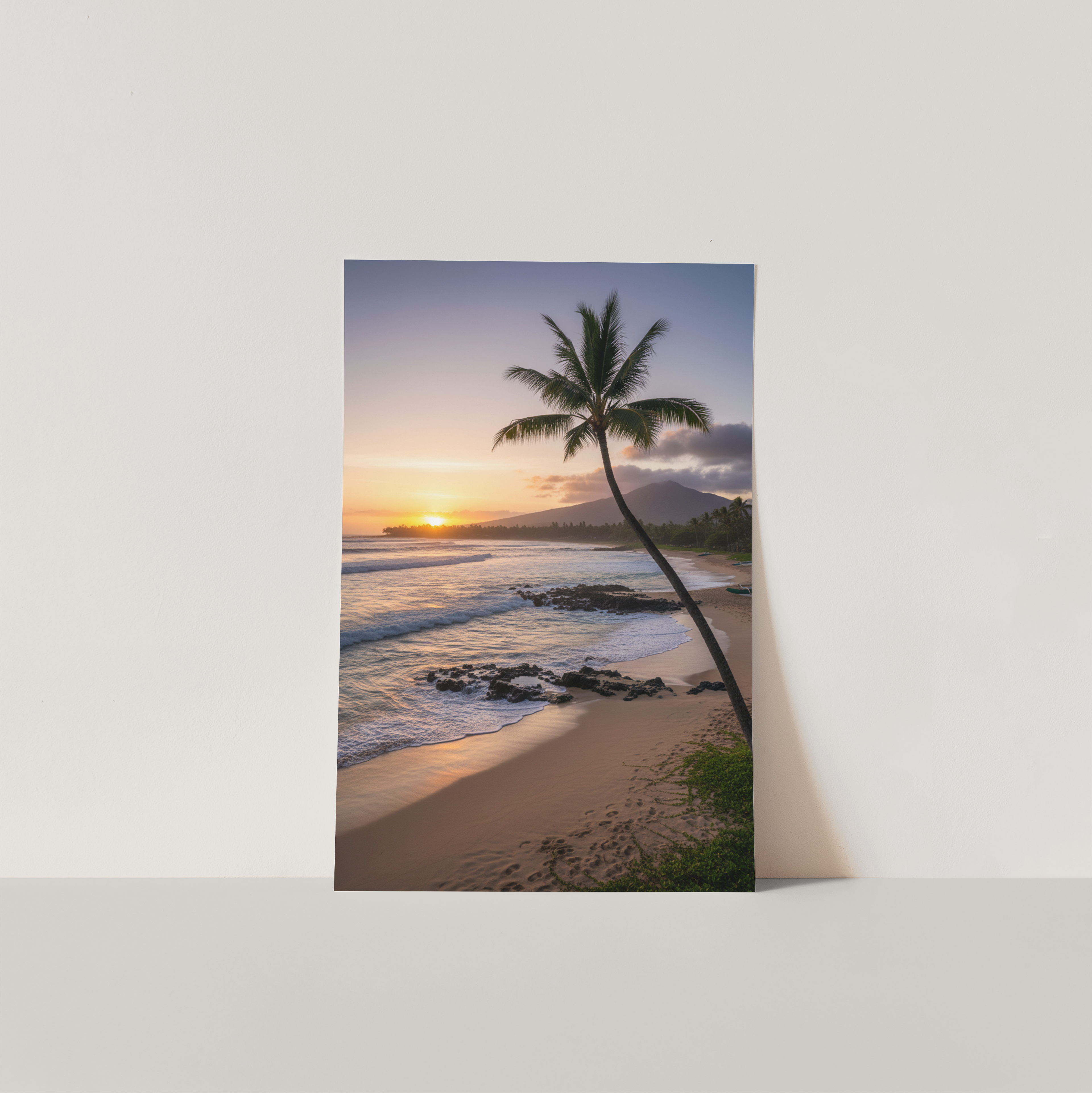 Poster of a tropical sunset with a palm tree on a white wall.